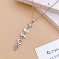 Silver multi-element drop necklace with stars and zircons on marble background - Star Bow Necklace Silver (XL5150)