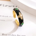Adjustable gold ring with black enamel, green clover patterns, diamonds and a center pearl - Lucky Clover Black (JZ819)