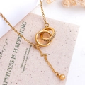 Goldene Halskette mit ineinandergreifenden Ringen, lila Zirkon und hängender Perle - Ineinandergreifender Kreis Quaste Stil (XL350) / Gold