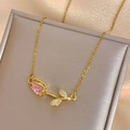 Elegant gold tulip necklace with a pink pear-shaped gemstone and shimmering leaf accents - Necklace / Pink Tulip Necklace Gold