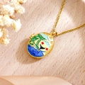 Oval gold-plated locket necklace with tropical island enamel design and zircon accents - Island Seascape Necklace (Blue & Gold)