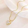 Golden snake chain necklace featuring a heart-shaped pendant with three zircon stones - White Zirconia - Medium (XL149) / Gold