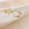 Adjustable gold tulip bracelet with pear-cut crystal and micro-pave accents on chiffon - White Tulip Bracelet Gold