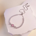 Adjustable silver bracelet featuring a pink heart-shaped crystal and cubic zirconia - Silver