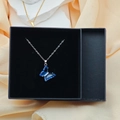Silver chain necklace featuring a deep blue crystal butterfly pendant in a gift box - Box