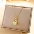 Elegant gold necklace with vintage green lucky bead pendant and sparkling crystals - Fortune Bead Bag Necklace (XL2254) / Gold