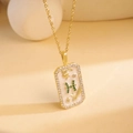 Gold rectangular necklace featuring white enamel and a green crystal letter H pendant - Pisces / Gold/Multicolor