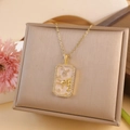 Gold Taurus zodiac rectangle pendant necklace with zircon border and bull relief - Taurus / Gold