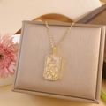 Golden zodiac necklace featuring a rectangular dragon pendant with white enamel inlay - Capricorn / Gold
