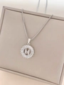 Silver tone letter M necklace with baguette-cut zircons and round medal pendant - Letter M / Silver