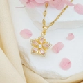 Drehbare Halskette mit rosa Zirkon-Blume in Gold-Finish und eleganten Strass-Details - Rosa Bauhinie (Goldene Lippenkette)
