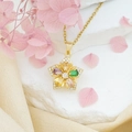 Halskette mit rotierendem Blumenanhänger, bunten Steinen und goldener Kette - Bunte Bauhinie (Goldene Kreuzkette)