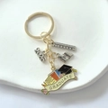 Detailed 2026 graduation keychain featuring enamel scroll, cap, books, and ruler charms - 2026-1# Style