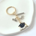 Detail view of 2026 graduation keychain featuring alloy mortarboard and ruler charms - 2026-8# Style