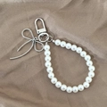 Elegant pearl phone charm and keychain with a silver snake chain bow and spring clasp - Silver Bow Pearl Style