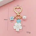 Cute cherry blossom heart keychain with enamel flowers, pearl, and gold metal clasp - Blue and White Bicolor Flower (Heart Buckle)