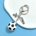 Soccer keychain pendant with miniature ball and silver metal cleats for sports fans - 3D Soft Soccer Style Three