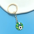 Detailed close-up of soccer keychain with blue football shoe and golden ring on stones - Soccer Ball Shoe Lightning Pendant (7#)