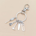 Vintage silver keychain set featuring miniature hammer, wrench, saw, and drill tool charms - Screwdriver Wrench Hammer Saw Hacksaw (1#)