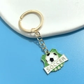Detail of shield-shaped soccer keychain with green enamel and golden star accents - SOCCER Shield Ball Three Stars Pendant (8#)