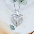 Silver heart wing pendant necklace with pavé stones on white marble background - Free Wings (XL1189) / Silver
