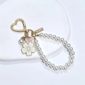 Handmade pearl keychain with heart clasp and enamel flowers on white stone display - Pink Bicolor Flower With Pearl Chain (LQ-01935)