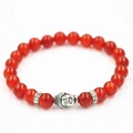 Pulsera étnica de cuentas rojas con un colgante de cabeza de Buda en color plata - Jaspe Rojo