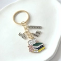 2026 graduation keychain featuring gold ring and enamel book with ruler and ABC charms - 2026-7# Style