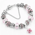 Pink charm bracelet with silver snake chain, floral beads and crystal pendant - Pink