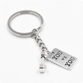 Retro dumbbell keychain with 'YOU VS YOU' engraved tag in polished silver alloy - You VS You Style