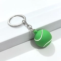Porte-clés balle de tennis 3D vert avec lignes blanches et anneau en métal argenté - Balle de Tennis en Colle Souple