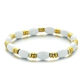 Elastic beaded bracelet with white oval beads and gold-tone textured metal accents - White and Gold Beaded Bracelet Style (XIAJIASL1576)