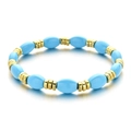 Bracciale elastico con perle ovali blu cielo e distanziali in metallo dorato testurizzato - Stile Bracciale con Perline Blu Cielo e Oro (XIAJIASL1585)
