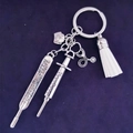 Silver medical themed keychain with syringe thermometer stethoscope and white tassel - White Tassel
