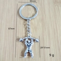 Porte-clés fitness avec pendentif culturiste et haltère sur fond en bois - Style d'Athlète 7