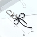 3D black bow keychain pendant with woven texture and silver metal ring for bags - Black Bowknot Door Buckle