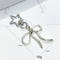 Silver metallic bow keychain with star-shaped clasp for bags and phone accessories - Star Bow Style