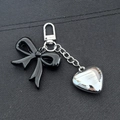 Fashionable keychain with black acrylic bow and silver metallic heart charm on a metal ring - Heart Black Bowknot Buckle