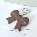 Brown acrylic bow keychain with heart metal clasp and sleek polished resin finish - Brown Ribbon Heart Buckle