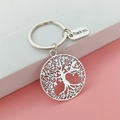 Porte-clés arbre de vie argenté avec breloque Thank You sur fond rose et bois blanc - Style Grand Arbre de Vie