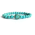 Elastic beaded bracelet with turquoise stones and a detailed sea turtle charm pendant - Turquoise