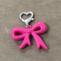 Vibrant pink bow pendant with silver heart metal lobster clasp on dark texture - Rose Red Bowknot Heart Buckle