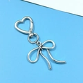 Silver bowknot keychain with heart-shaped spring clasp on light blue background - Antique Silver Bowknot Heart Buckle