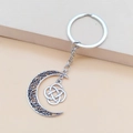 Retro silver crescent moon keychain with hollow patterns and a Celtic knot pendant - Moon And Celtic Knot
