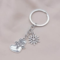 Silver alloy Christmas keychain featuring detailed stocking and snowflake pendants - Size 6