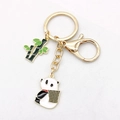 Panda and green bamboo charms on a light gold metal keychain with lobster clasp - Basket Panda Style