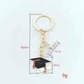 Academic graduation keychain featuring black mortarboard and diploma pendants for students - 2026-6#