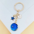 Porte-clés Gémeaux avec pendentifs ciel étoilé bleu et détails en métal doré - Gémeaux
