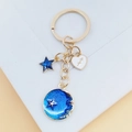 Porte-clés doré avec étoiles en émail bleu foncé et pendentif coeur de Sagittaire - Sagittaire
