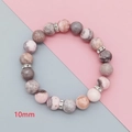 Macro shot of 10mm pink zebra stone beads with silver crystal spacers on bracelet - Pink Zebra Large Size Silver Rhinestone Style
